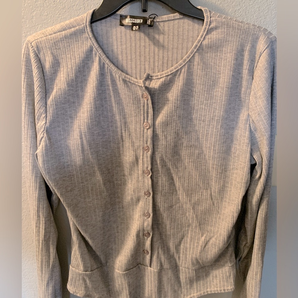 Woman’s long sleeve body suit.